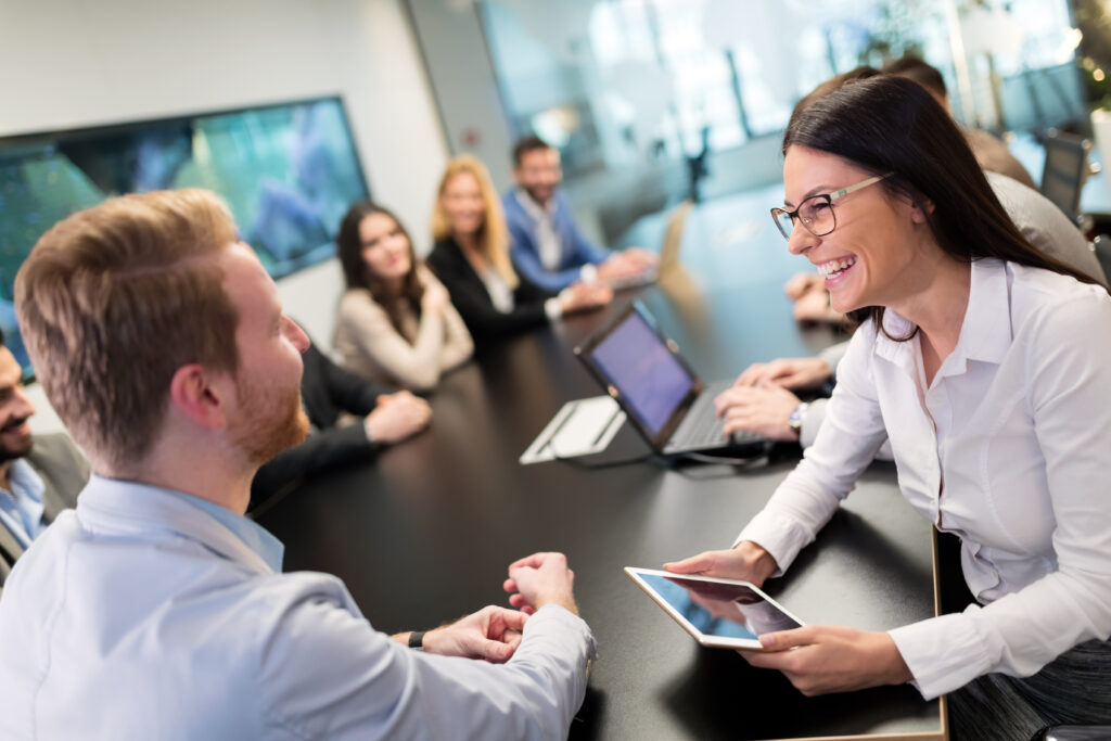 A sales representative having a positive interaction with potential clients.